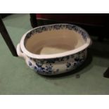 A late Victorian transfer printed foot bath with twin handles,