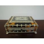 A late 19th Century Anglo-Indian influenced tortoiseshell and ivory box with pierced fret panels