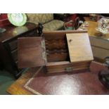 An early 20th Century walnut stationary stand with single drawer