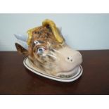 A late 19th Century ceramic cheese dish in the form of a cows head