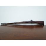 A miniature apprentice model of a 19th Century percussion rifle,