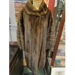 A mink coat circa 1950's swing style with deep cuffs