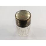 A Deakin and Francis silver topped smelling salts bottle with beaver crest to top,