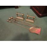 A companion set of brass fire tools comprising of poker, tongs and shovel, a pair of fire dogs,