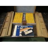 A mid 20th Century oriental Mahjong set with boards,