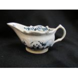 An 18th Century Lowestoft porcelain sauce boat, blue and white,