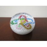 A Saint Louis paperweight millefiori garland on latticinio ground 350/400,