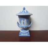 A 20th Century Wedgwood blue Jasper ware urn with cover, approximately 27cm tall,