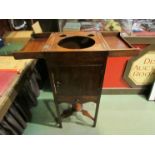 A George III mahogany gentleman's washstand the rising top over a single door cupboard and drawer