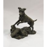 A cold cast bronzed figure of a Jack Russell playing, signed J.
