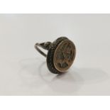 An early 20th Century ring with deer motif marked 800 R.S.