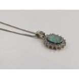 WITHDRAWN - An 18ct white gold opal and diamond pendant,