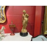 A pair of 19th Century bronzed spelter figurines of musician and dancing lady,