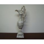 A Victorian carved marble ewer on plinth,