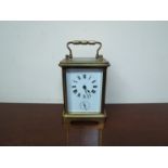 An early 20th Century brass carriage clock with alarm mechanism,