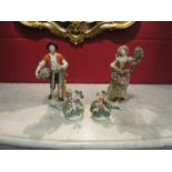 A pair of 20th Century Rudolf Kammer of Volkstedt figures of man and woman with flowers together