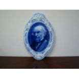 A Middlepart Pottery blue and white ceramic portrait plaque