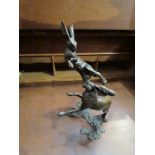 Two bronze boxing hares