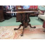 A 19th Century rosewood double drop flap pedestal table