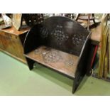 A Victorian carved settle,