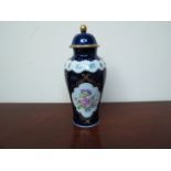 A 20th Century German Wallendorf porcelain lidded vase with hand-painted floral detail,