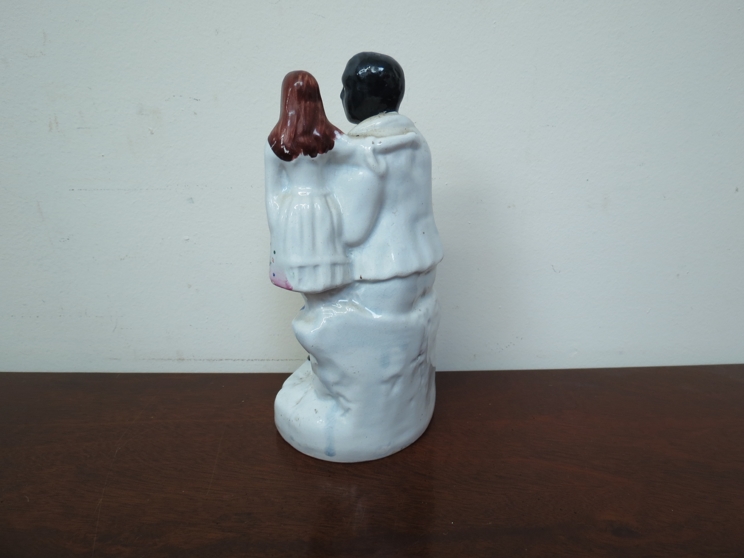 A 19th Century Victorian Staffordshire figure black servant with girl, - Image 2 of 4