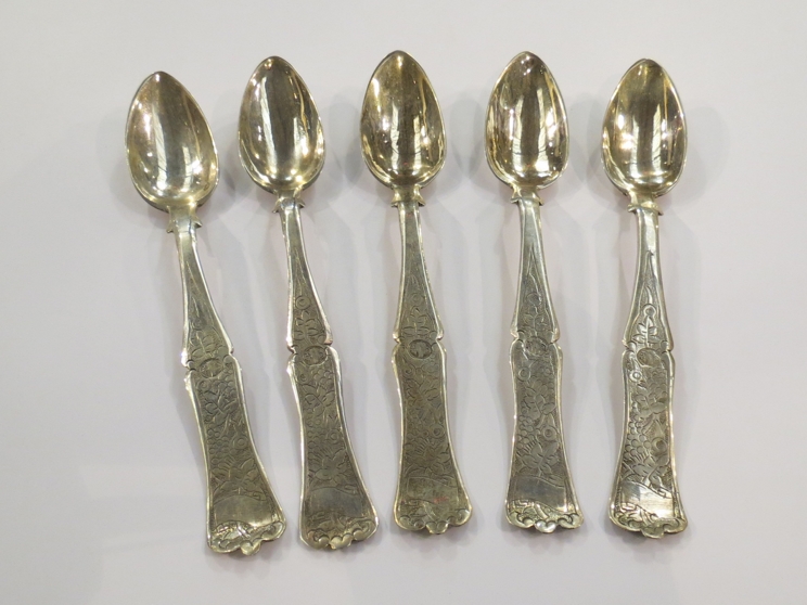A set of five Middle-Eastern white metal teaspoons stamped to bowls,