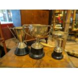 Three silver trophies including golfing example, the handles as clubs,