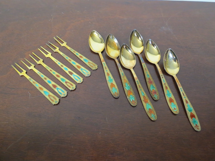 A set of six teaspoons and forks marked 875 with enamel embellishment