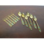 A set of six teaspoons and forks marked 875 with enamel embellishment