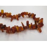 A raw amber necklace with a 9ct natural gold clasp