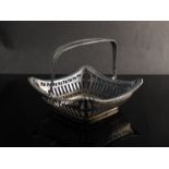 A pierced silver bon-bon dish with handle,