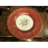 Two Royal Worcester cabinet plates, pink gilt and red gilt borders, with central floral spray, 26.