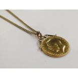 A gold half sovereign hung on a 9ct gold chain
