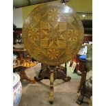 A Black Forest walnut geometric marquetry inlaid top occasional table