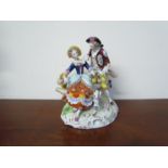 A Sitzendorf figural group "Courting Couple with dog",