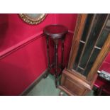 A reproduction mahogany jardiniere stand,