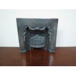 A 19th Century cast metal tradesman's fireplace, 21cm x 22cm,