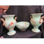 A pair of Spode bone china twin handled urns and a bowl, all decorated with exotic pheasant,