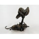 A bronze mushroom with three mice, 7.