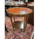 A French Kingwood parquetry and strung inlaid two tier lamp table with brass edge and single frieze