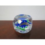 A Saint Louis paperweight, four blue flowers on white filigrane,