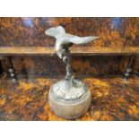 An early 20th Century bronze figure of a bird in flight