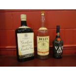 Three vintage spirit display bottles of large proportions,