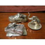 Two white metal trinket boxes, one in the form of a Dutch clog,