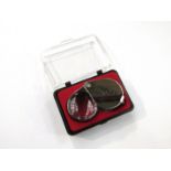 A 30x metallic jeweller's loupe,