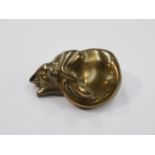 A gilt painted figure of a curled up cat,