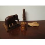 Four pieces of treen including elephant bookend, miniature shoe last,