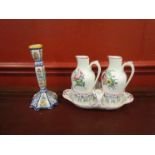 A French vinegar and oil cruet set and candlestick