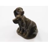 A cold cast bronze sculpture of two Spaniels